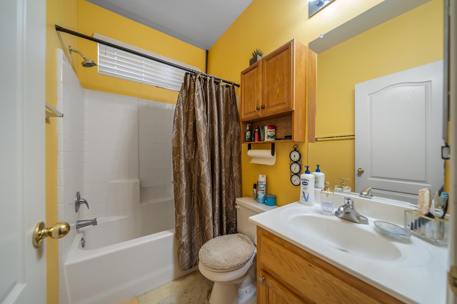 1114 Kay Circle Turlock, CA 95382 - Photo 27 of 40 a bathroom with a sink a toilet and a mirror