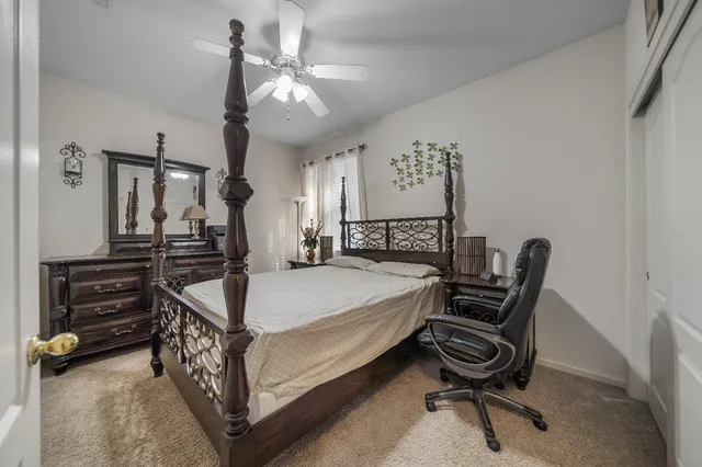 a bed room with a bed and furniture