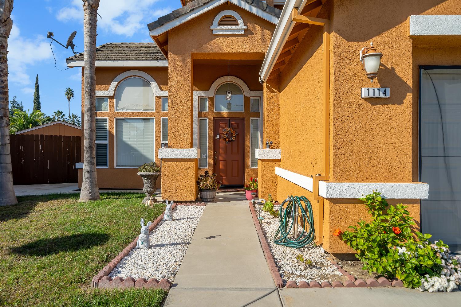 1114 Kay Circle Turlock, CA 95382 - Photo 3 of 40 a front view of a house with garden