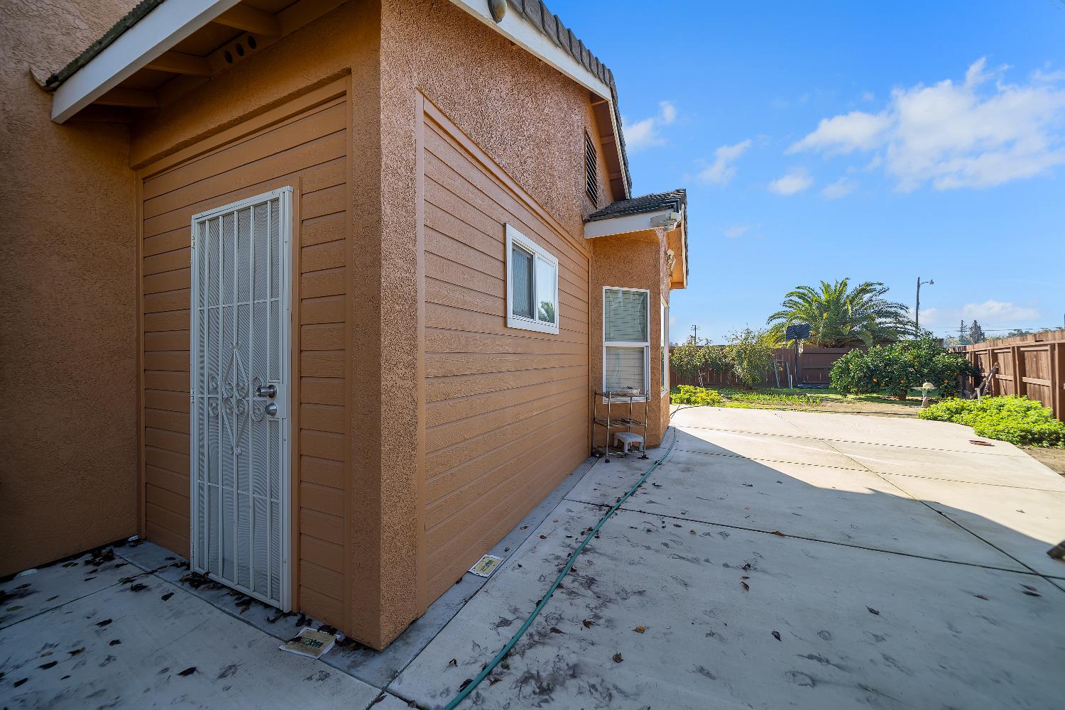 1114 Kay Circle Turlock, CA 95382 - Photo 33 of 40 a view of a house with backyard and a tree