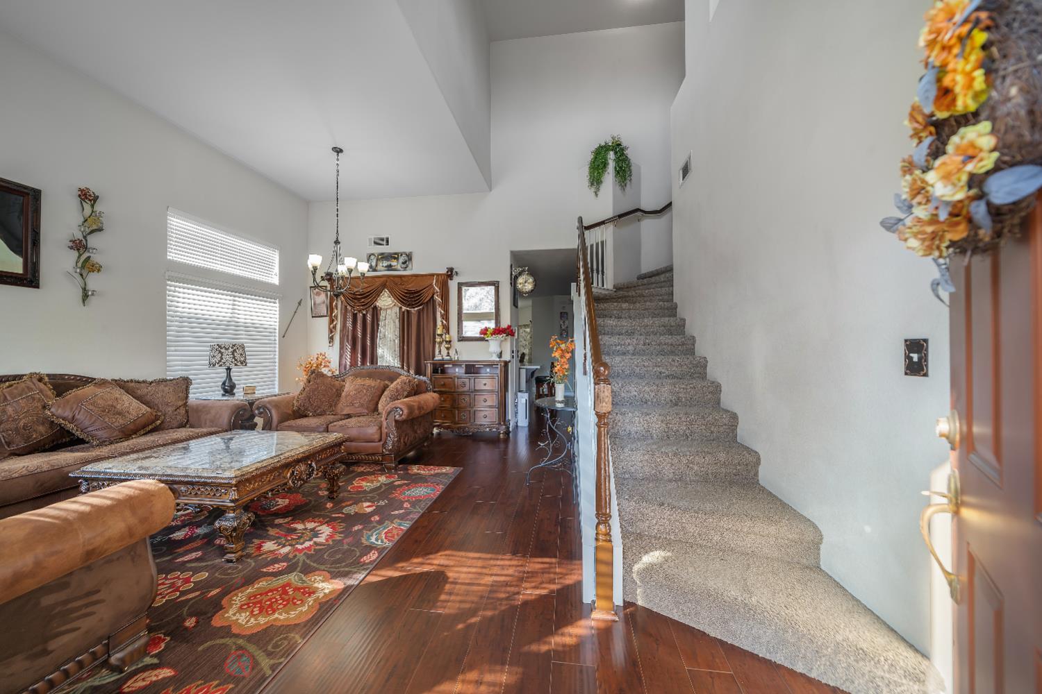 1114 Kay Circle Turlock, CA 95382 - Photo 5 of 40 a living room with furniture and a chandelier