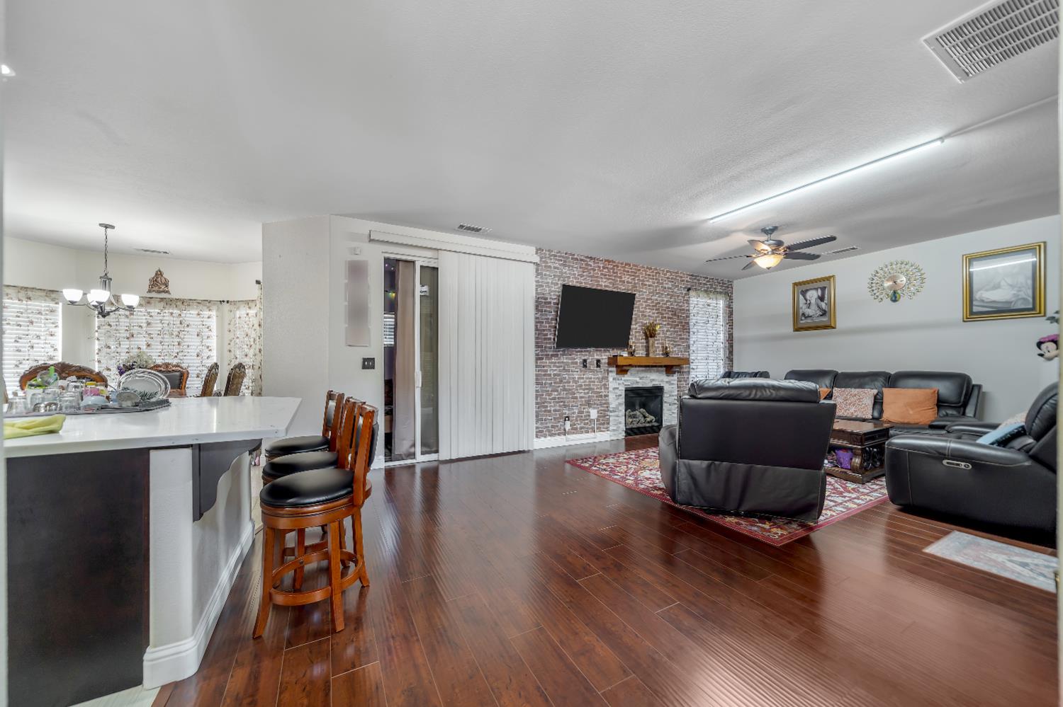 1114 Kay Circle Turlock, CA 95382 - Photo 10 of 40 a living room with furniture and a flat screen tv