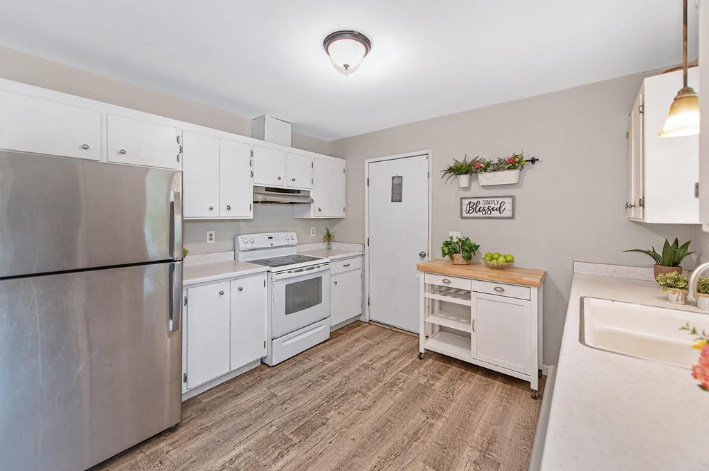6689 Rhodes Avenue Placerville, CA 95667 - Photo 21 of 60 a kitchen with white cabinets and white appliances