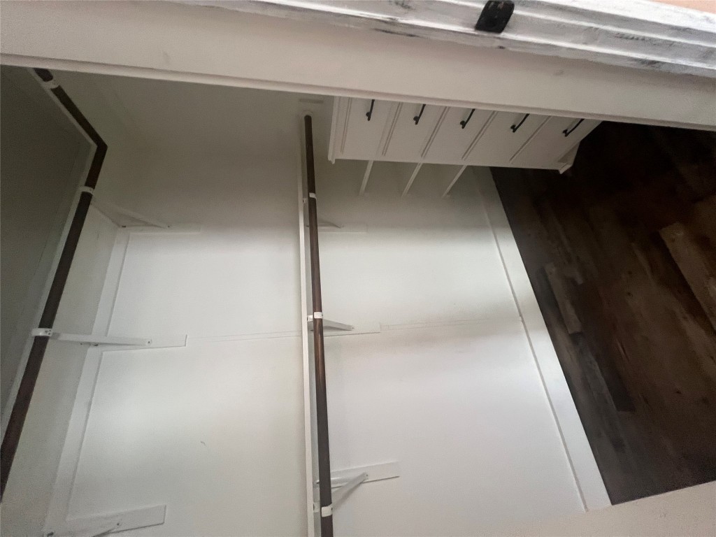 106 Bridle Path, Unit B Kyle, TX 78640 - Photo 14 of 25 a view of walk in closet with empty racks