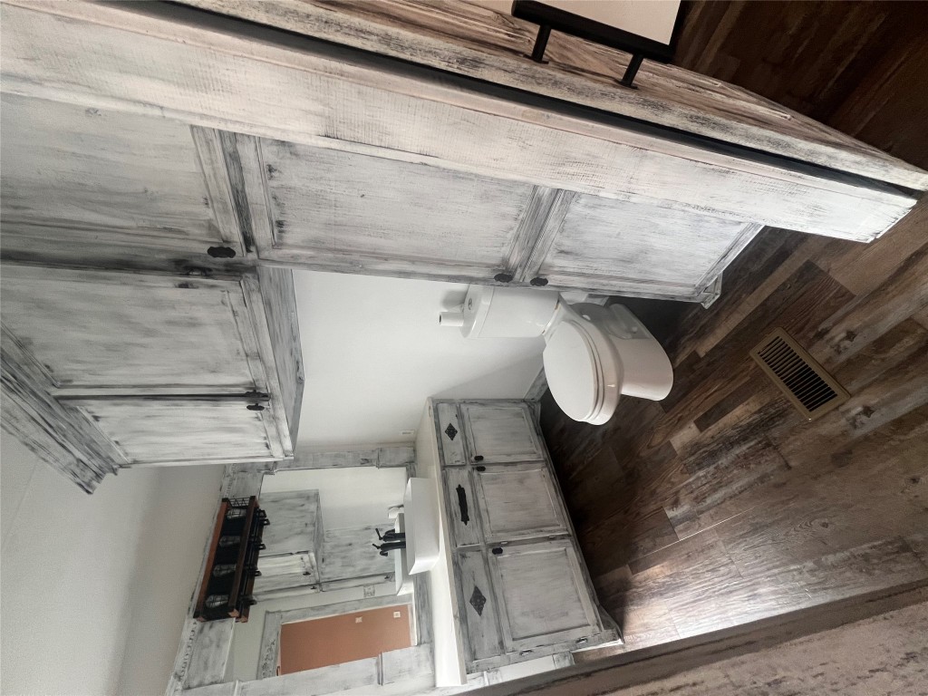 106 Bridle Path, Unit B Kyle, TX 78640 - Photo 16 of 25 a bathroom with a granite countertop sink toilet and shower