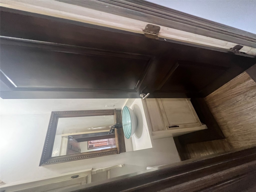 106 Bridle Path, Unit B Kyle, TX 78640 - Photo 20 of 25 a bathroom with a sink a toilet and a mirror