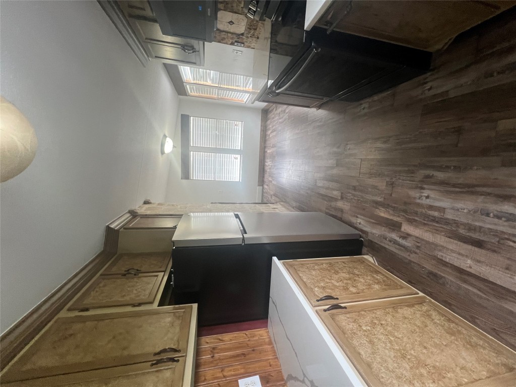 106 Bridle Path, Unit B Kyle, TX 78640 - Photo 2 of 25 a kitchen with stainless steel appliances a refrigerator and a stove