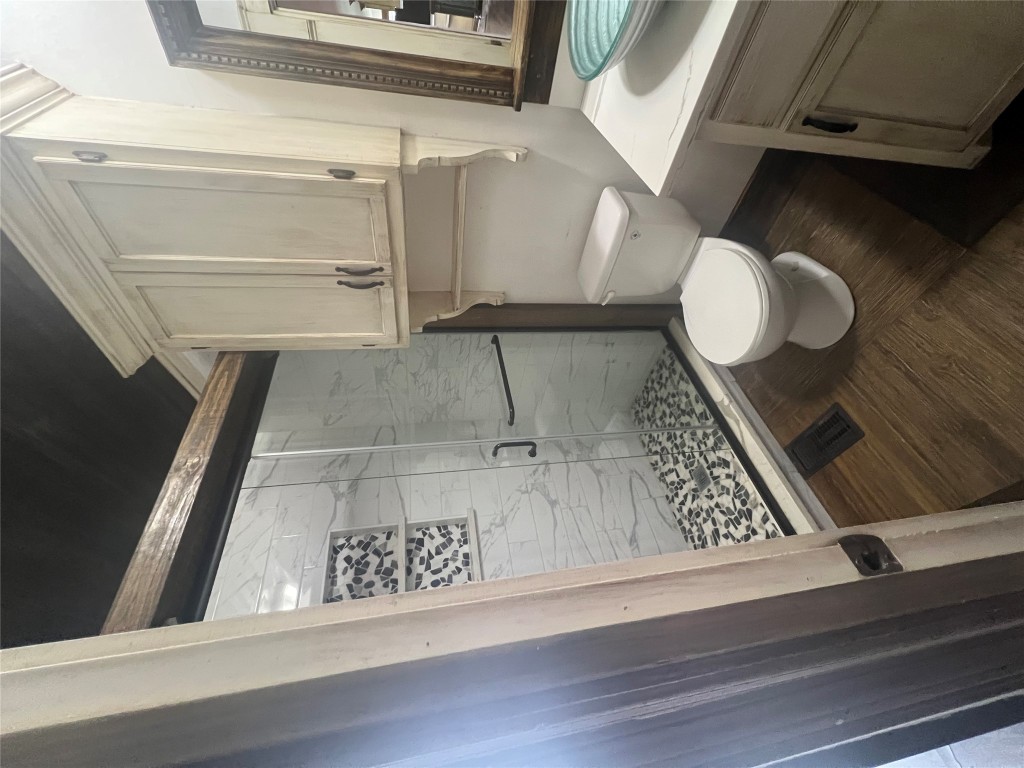 106 Bridle Path, Unit B Kyle, TX 78640 - Photo 21 of 25 a bathroom with a sink and a mirror