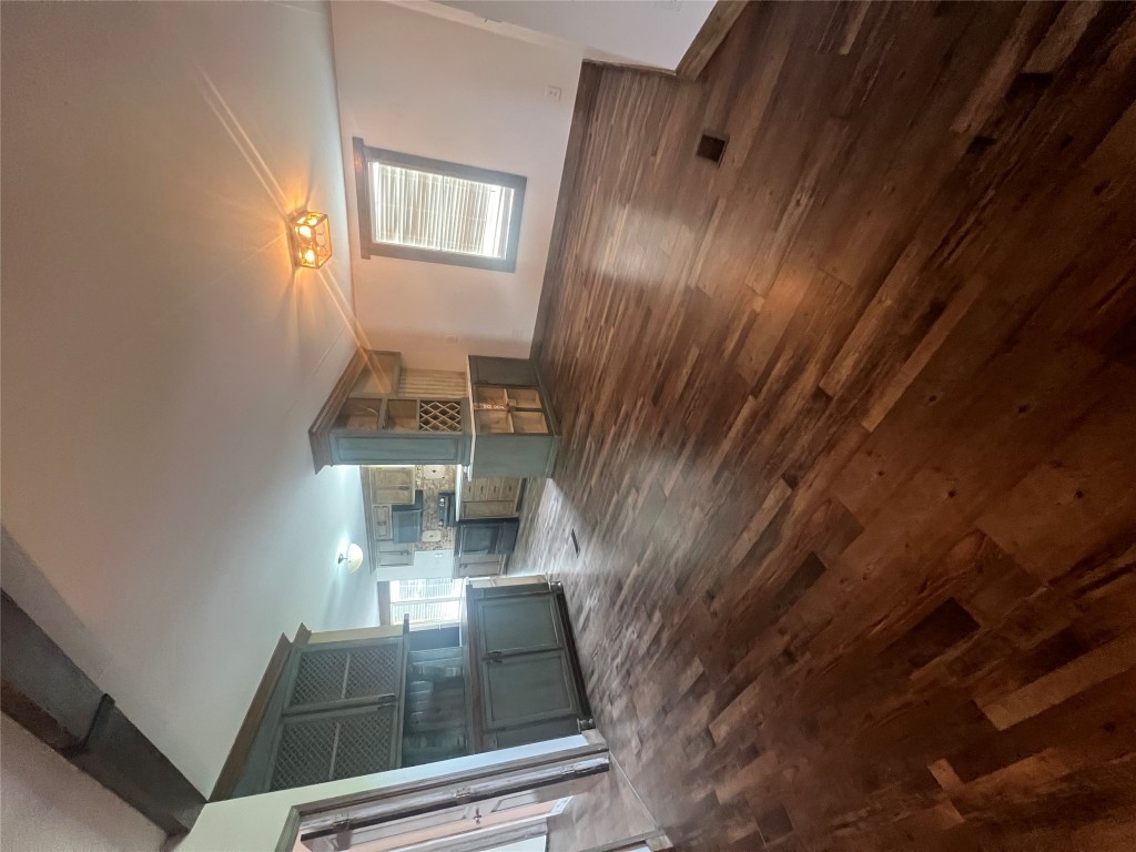 106 Bridle Path, Unit B Kyle, TX 78640 - Photo 24 of 25 a view of empty room with wooden floor