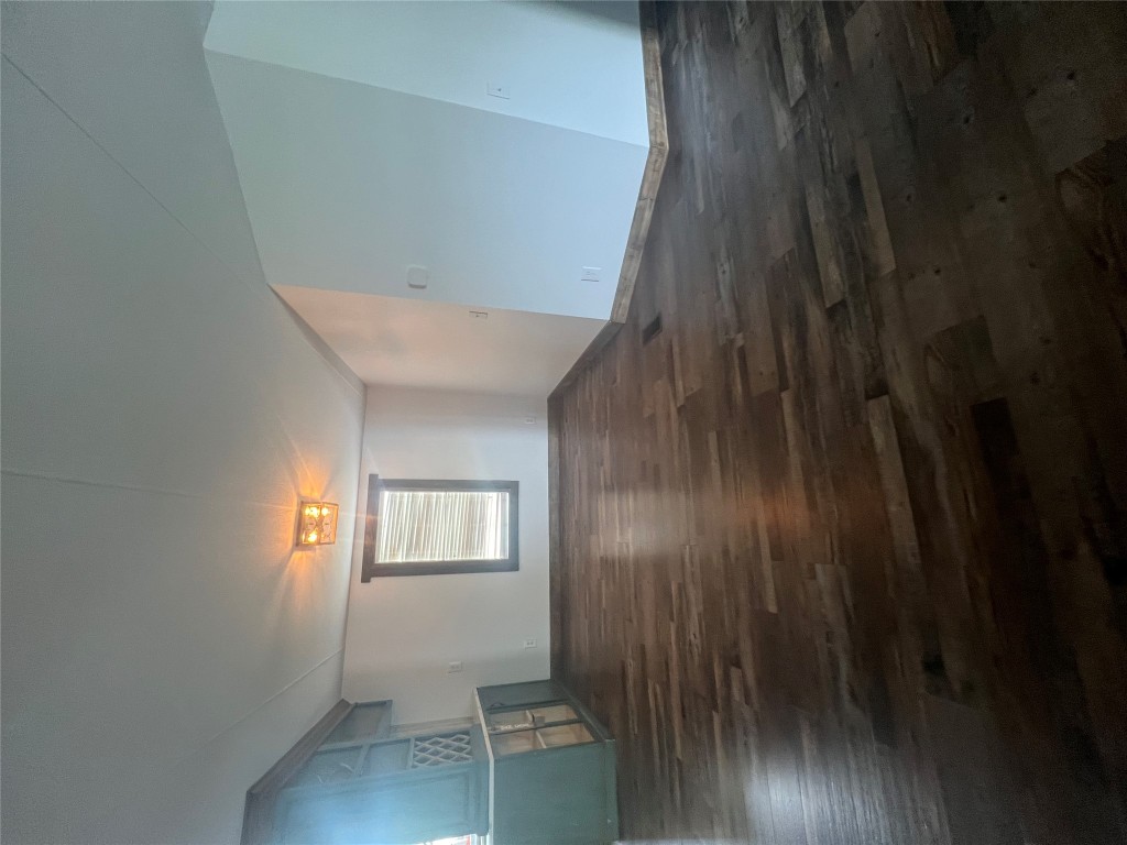 106 Bridle Path, Unit B Kyle, TX 78640 - Photo 8 of 25 a view of room with window and wooden floor