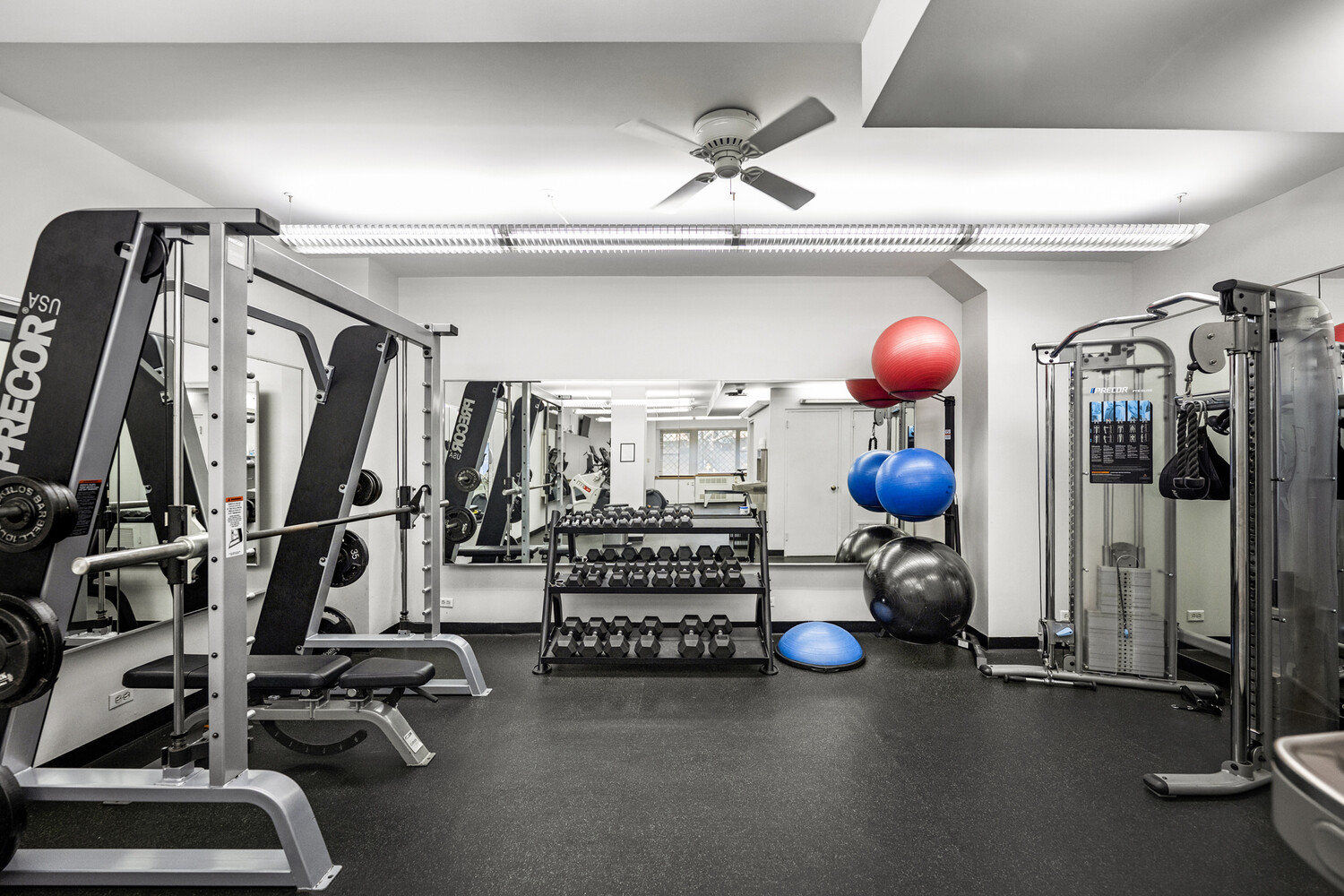 165 East 72nd Street, Unit 12J Manhattan, NY 10021 - Photo 9 of 13 a view of a room with gym equipment