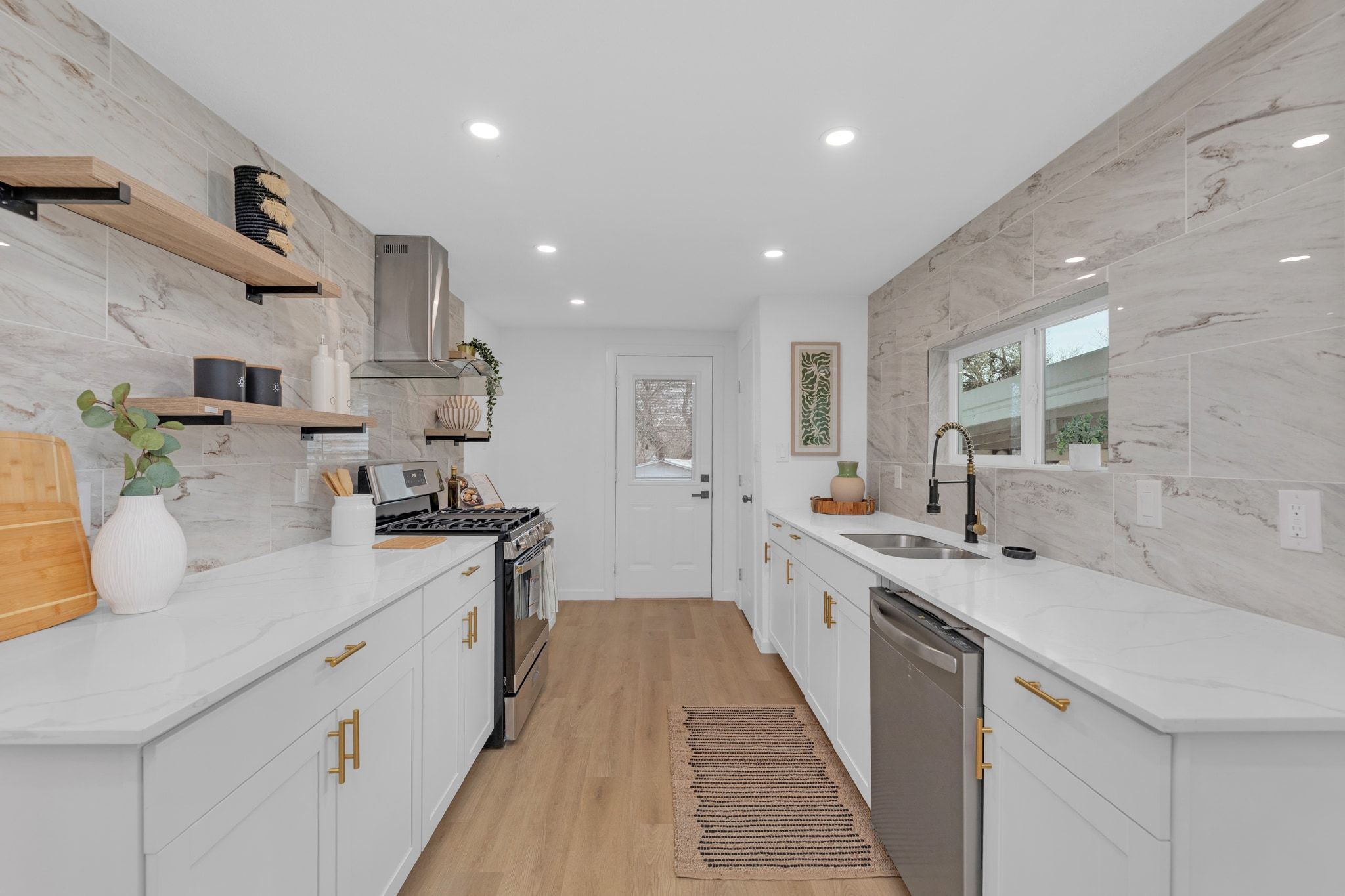 1709 Cecelia Street Taylor, TX 76574 - Photo 13 of 38 Kitchen with light stone counters, stainless steel appliances, open shelves, white cabinets, and recessed lighting
