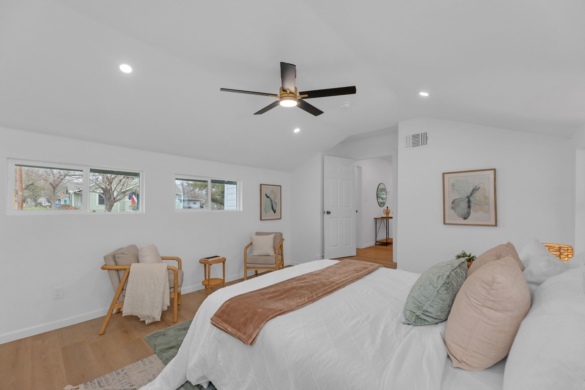1709 Cecelia Street Taylor, TX 76574 - Photo 23 of 38 Bedroom with wood finished floors, a ceiling fan, recessed lighting, and vaulted ceiling