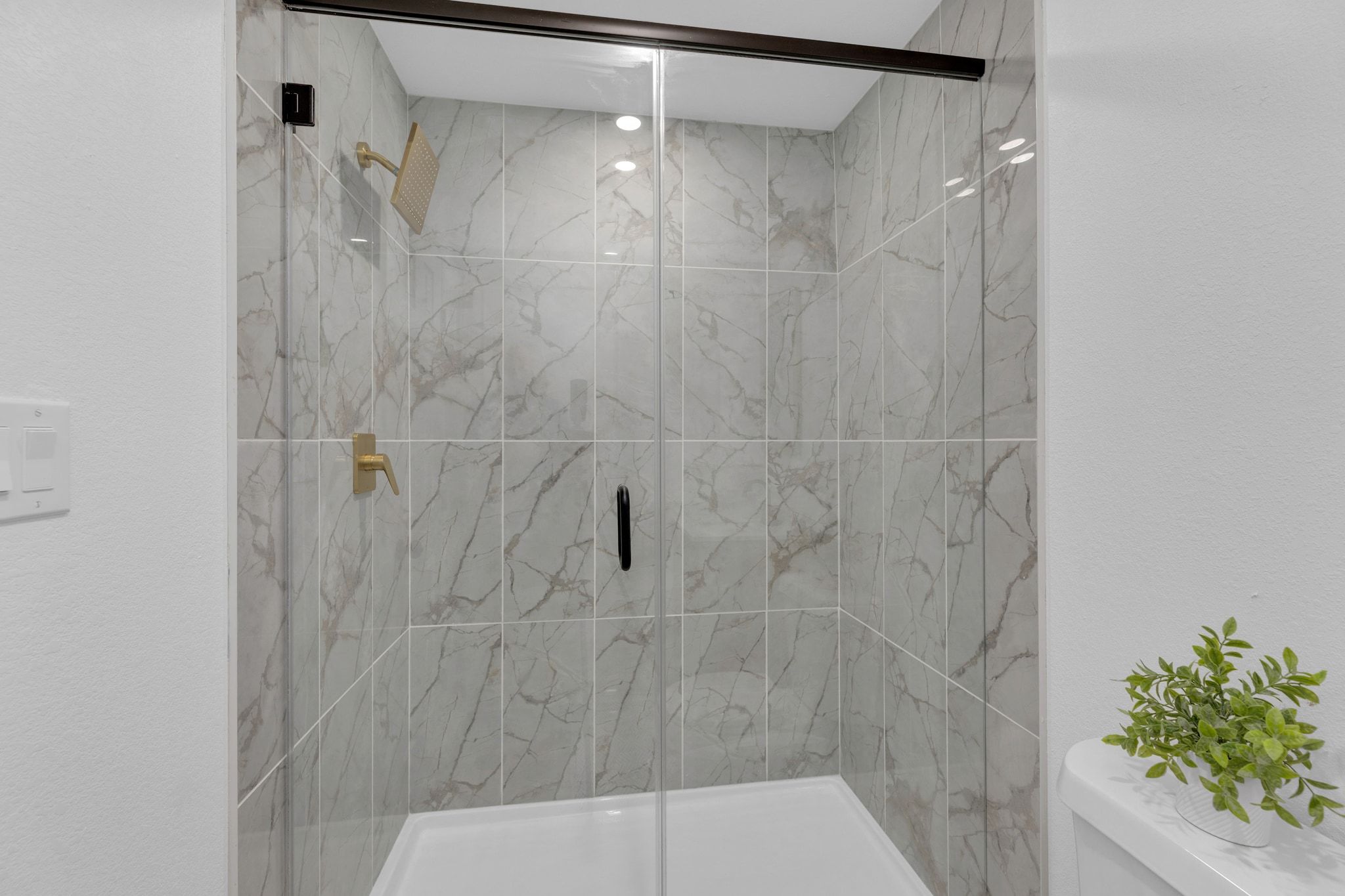 1709 Cecelia Street Taylor, TX 76574 - Photo 26 of 38 Full bath featuring a marble finish shower and toilet