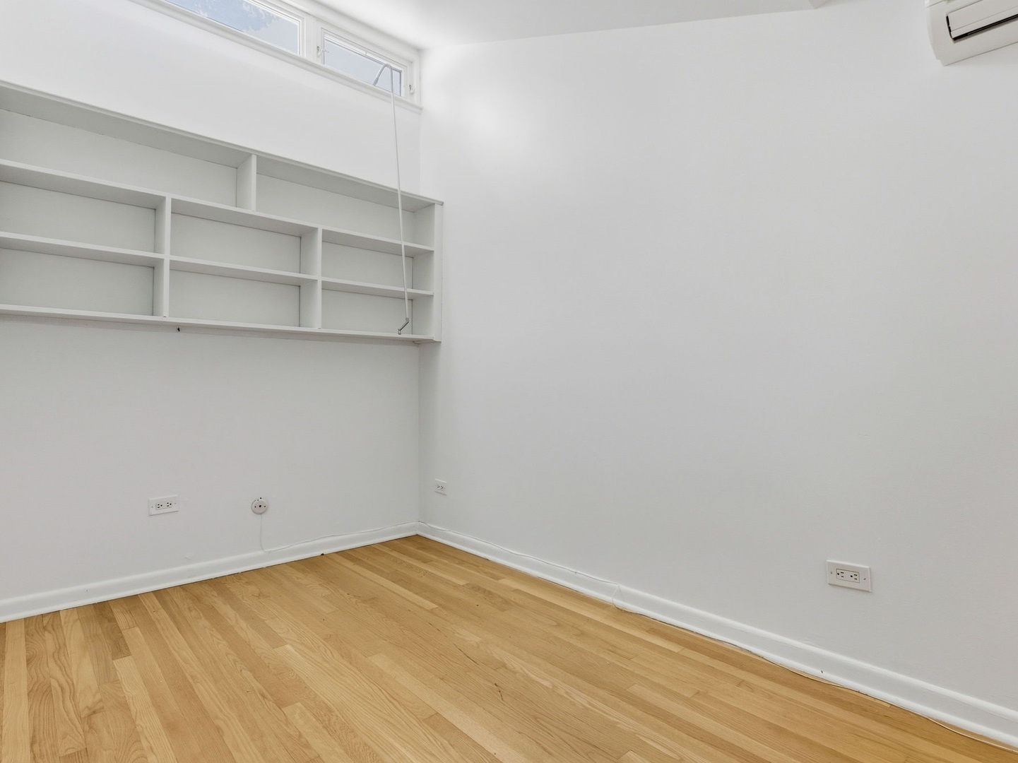1412 East Rochdale Place Chicago, IL 60615 - Photo 16 of 21 a view of a room with empty racks