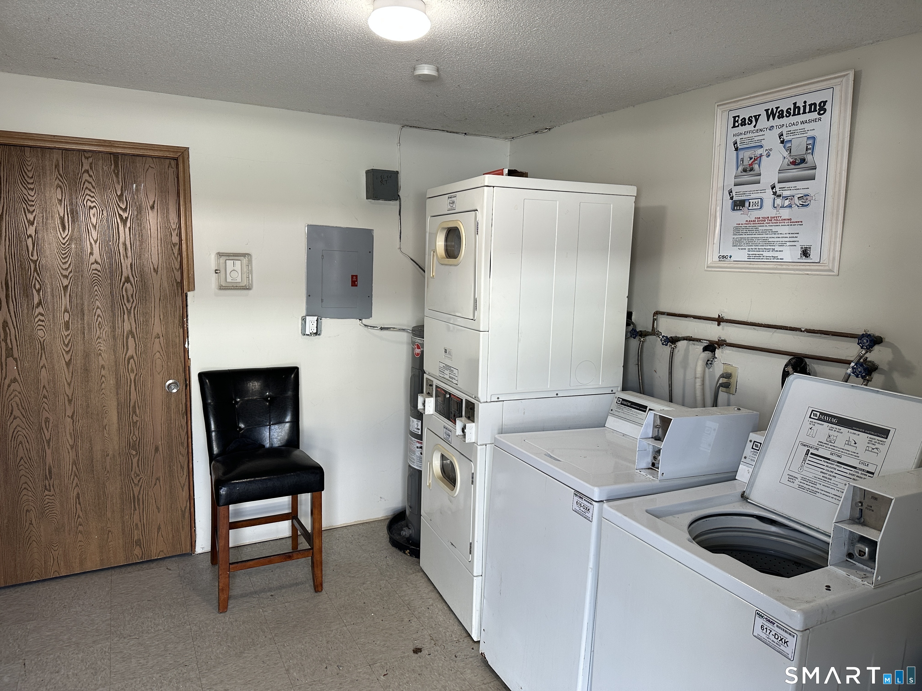 114 Bucks Hill Road, Unit 4 Waterbury, CT 06704 - Photo 12 of 12 a utility room with dryer washer and a view of living room
