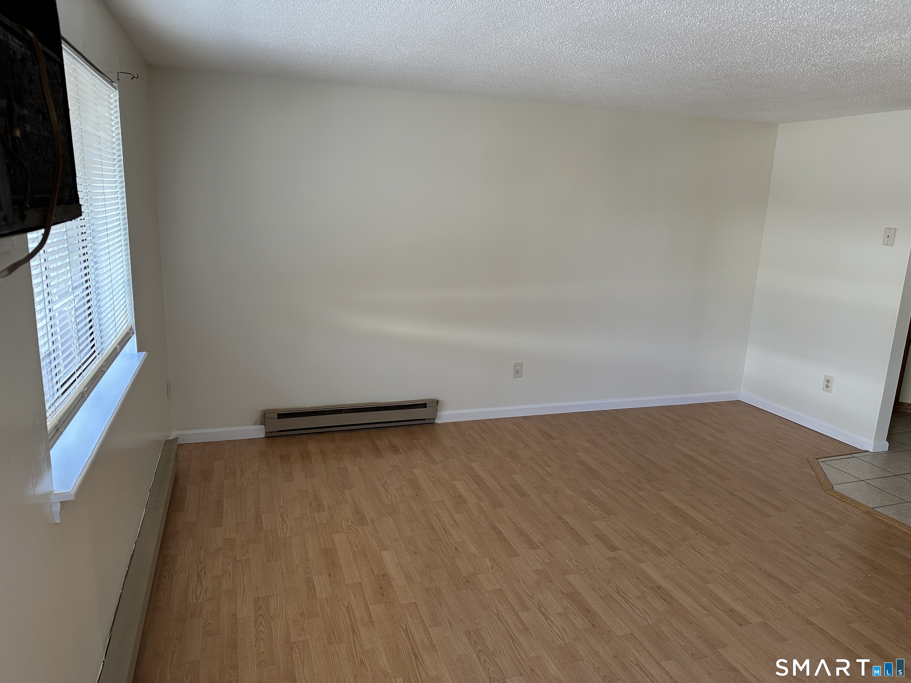 114 Bucks Hill Road, Unit 4 Waterbury, CT 06704 - Photo 3 of 12 a view of an empty room and window