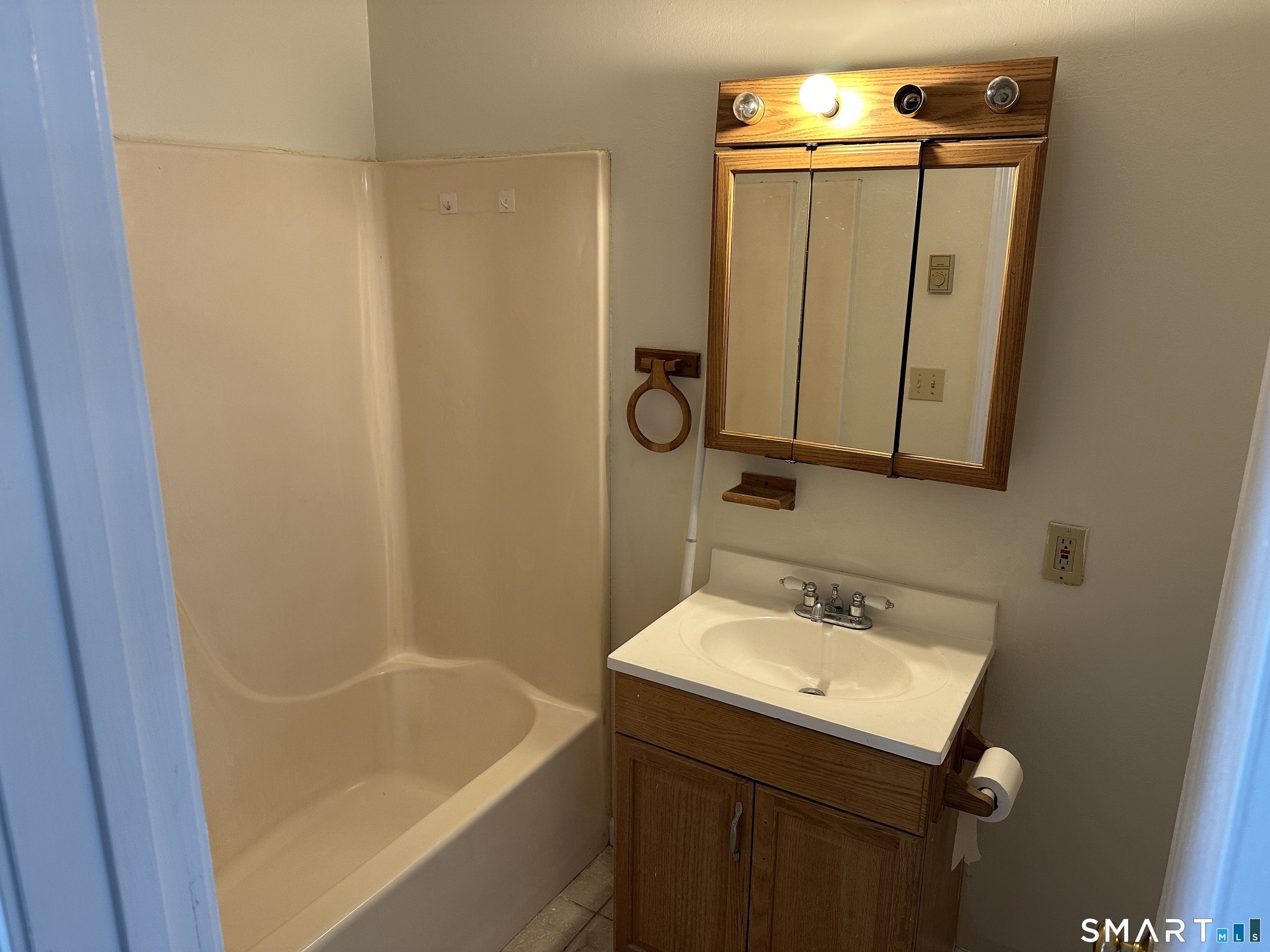 114 Bucks Hill Road, Unit 4 Waterbury, CT 06704 - Photo 7 of 12 a bathroom with a sink and a mirror
