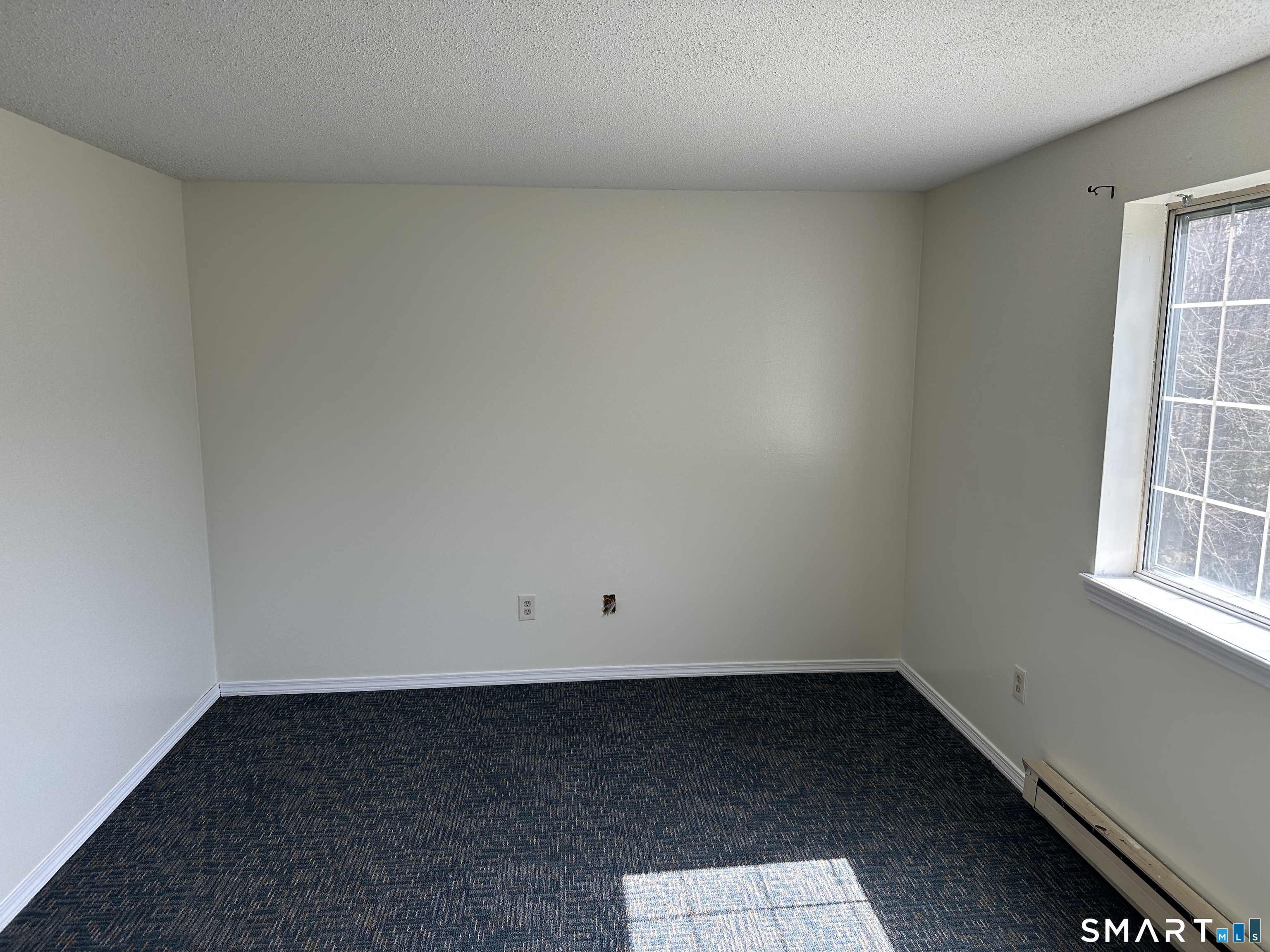 114 Bucks Hill Road, Unit 4 Waterbury, CT 06704 - Photo 9 of 12 an empty room with a window