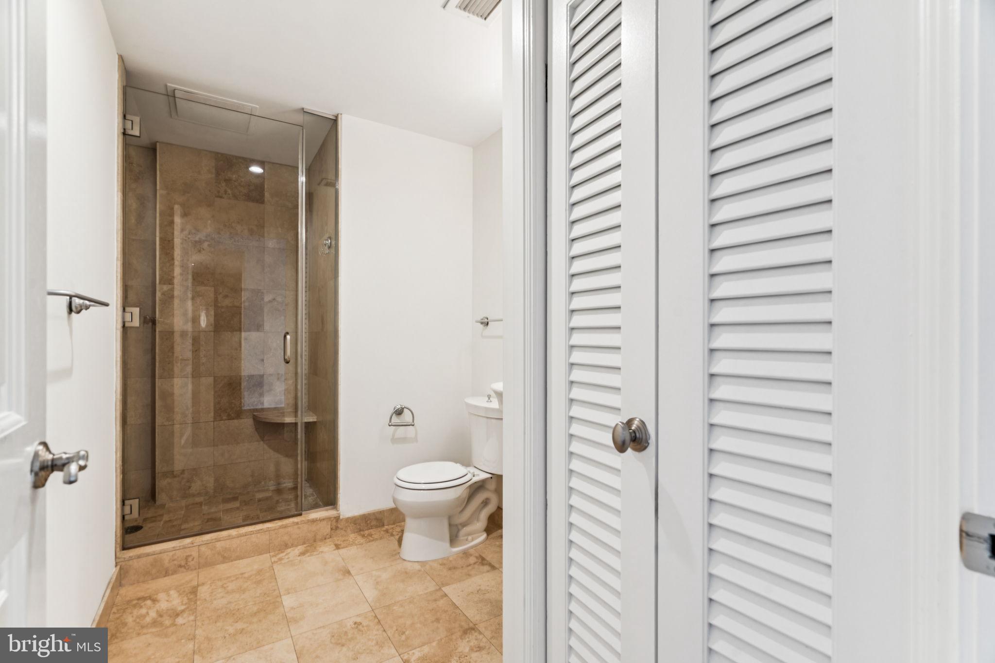 1701 Locust Street, Unit 2111 Philadelphia, PA 19103 - Photo 13 of 25 a bathroom with a toilet a sink and shower