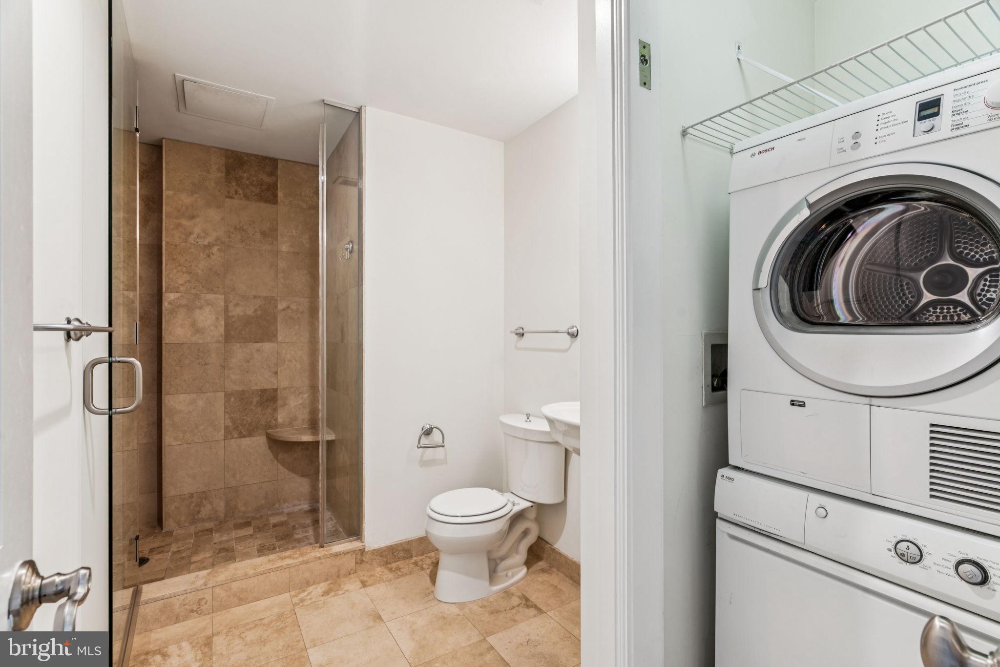 1701 Locust Street, Unit 2111 Philadelphia, PA 19103 - Photo 17 of 25 a bathroom with a toilet and a shower