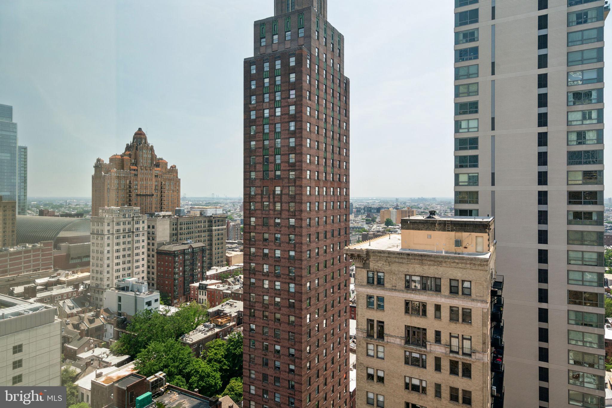 1701 Locust Street, Unit 2111 Philadelphia, PA 19103 - Photo 19 of 25 a view of a city with tall buildings