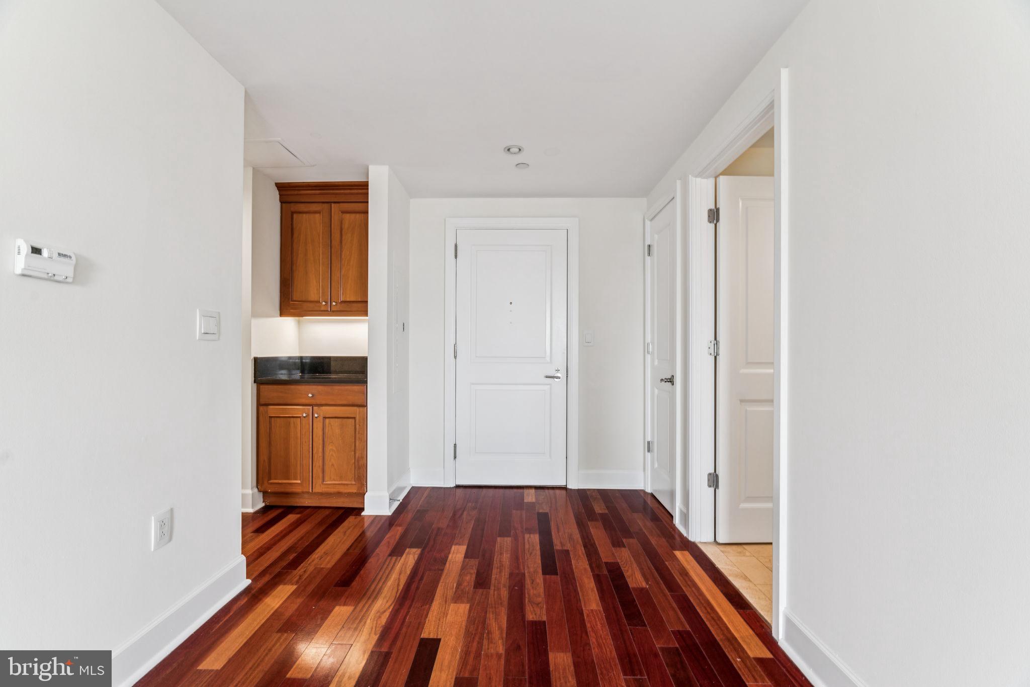 1701 Locust Street, Unit 2111 Philadelphia, PA 19103 - Photo 5 of 25 a view of a bedroom with wooden floor and closet