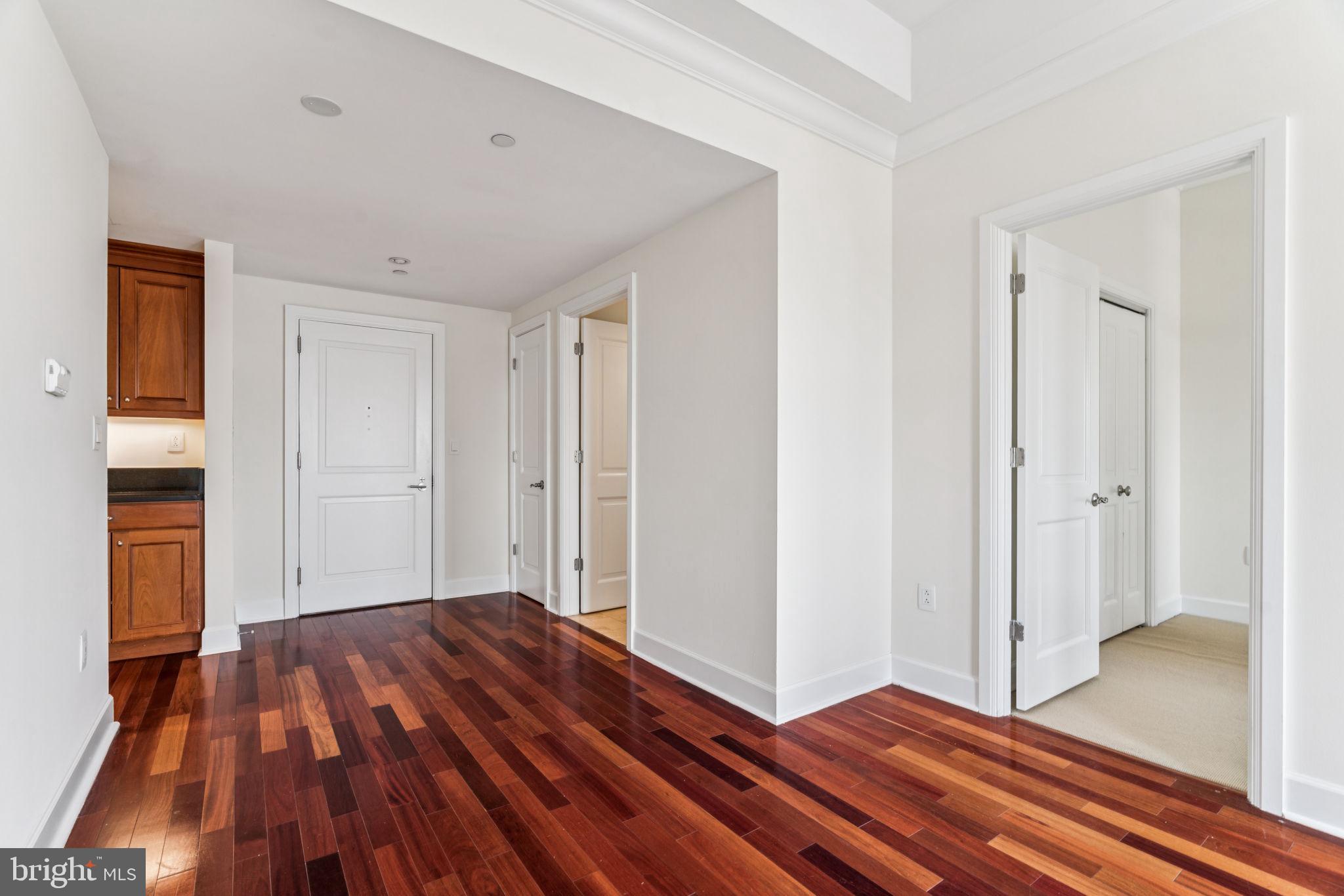 1701 Locust Street, Unit 2111 Philadelphia, PA 19103 - Photo 6 of 25 a view of a room with wooden floor and gate
