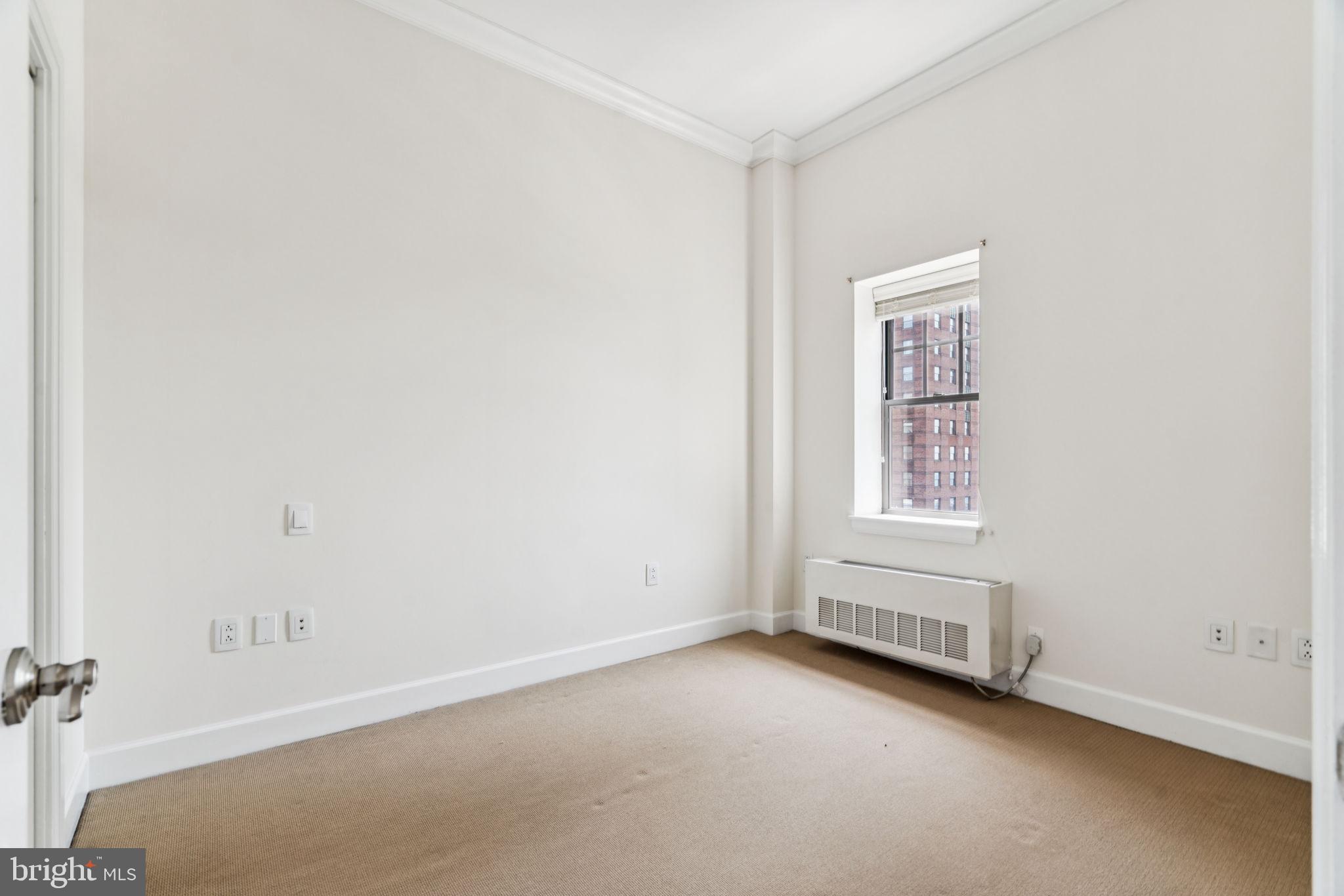 1701 Locust Street, Unit 2111 Philadelphia, PA 19103 - Photo 10 of 25 an empty room with windows