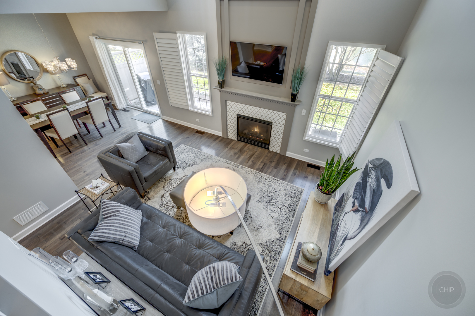 201 Dorset Avenue, Unit 201 Oswego, IL 60543 - Photo 21 of 41 a living room with furniture a flat screen tv and a fireplace