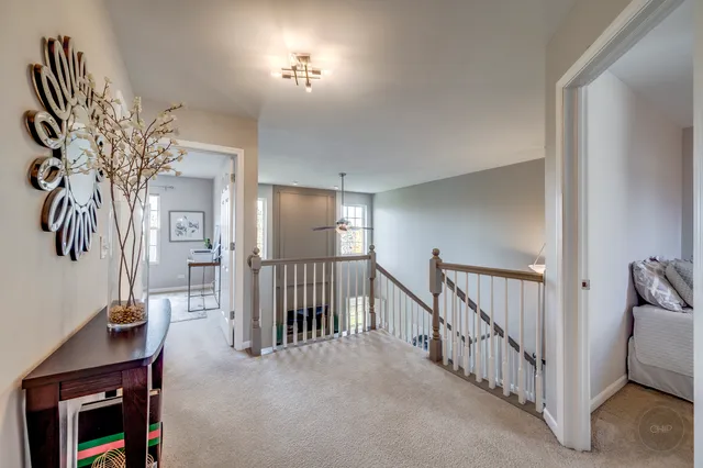 a room with a bed and a chandelier