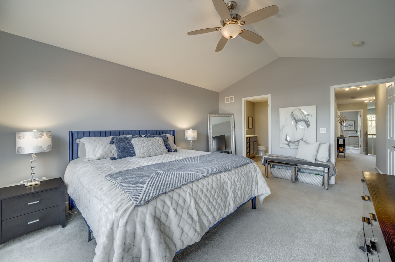 201 Dorset Avenue, Unit 201 Oswego, IL 60543 - Photo 32 of 41 a spacious bedroom with a bed and ceiling fan