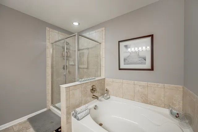 a spacious bathroom with a toilet sink and mirror