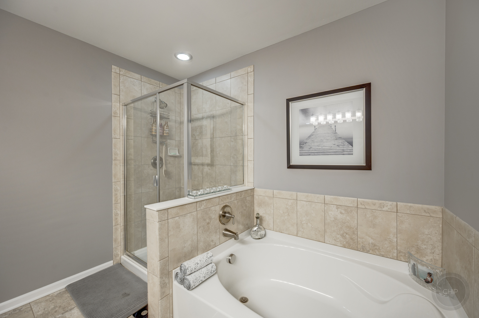 201 Dorset Avenue, Unit 201 Oswego, IL 60543 - Photo 34 of 41 a bathroom with a bathtub and shower