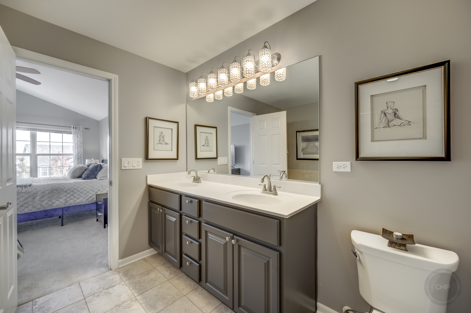 201 Dorset Avenue, Unit 201 Oswego, IL 60543 - Photo 35 of 41 a spacious bathroom with a toilet sink and mirror