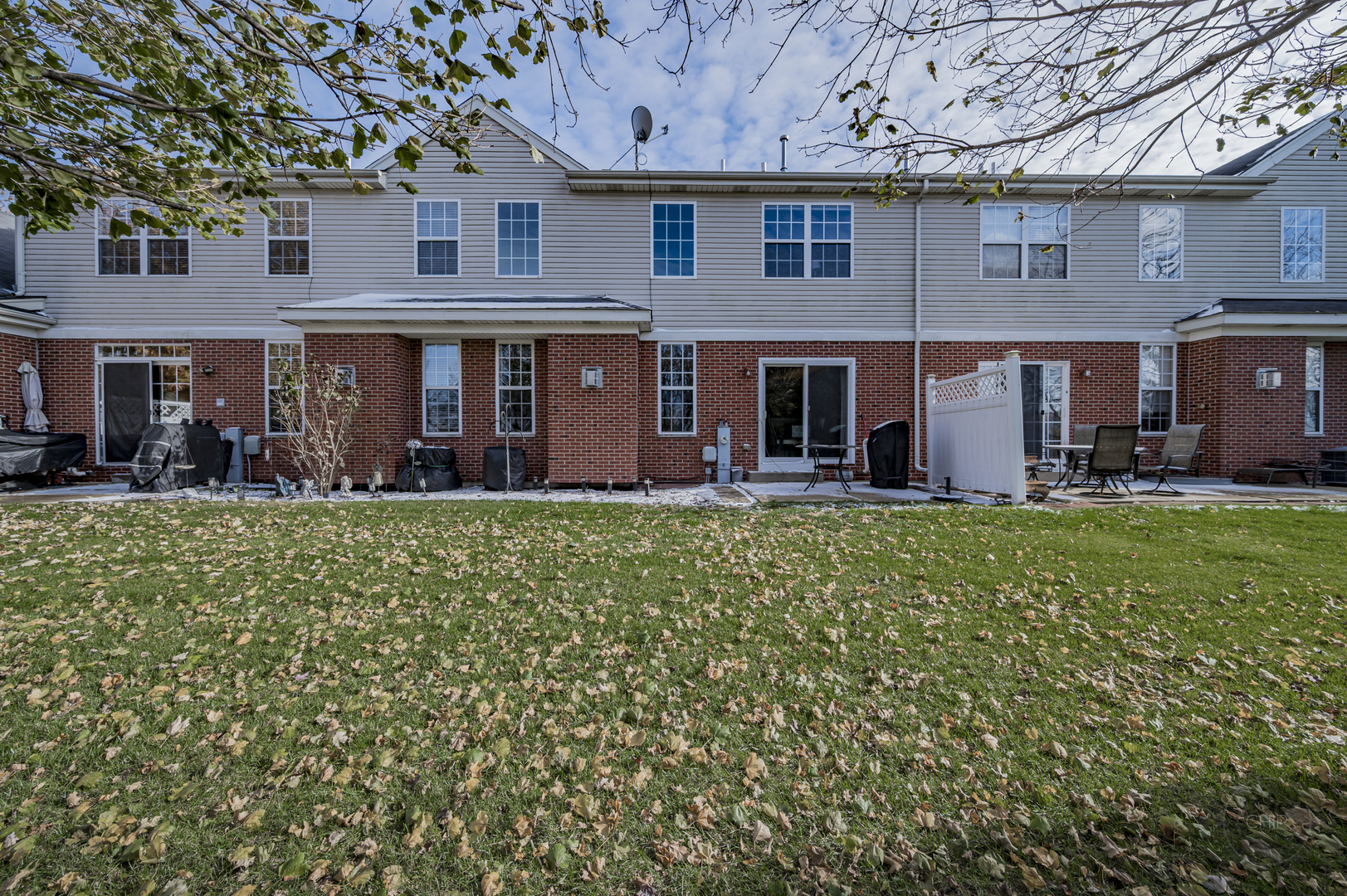 201 Dorset Avenue, Unit 201 Oswego, IL 60543 - Photo 39 of 41 front view of a building with a yard