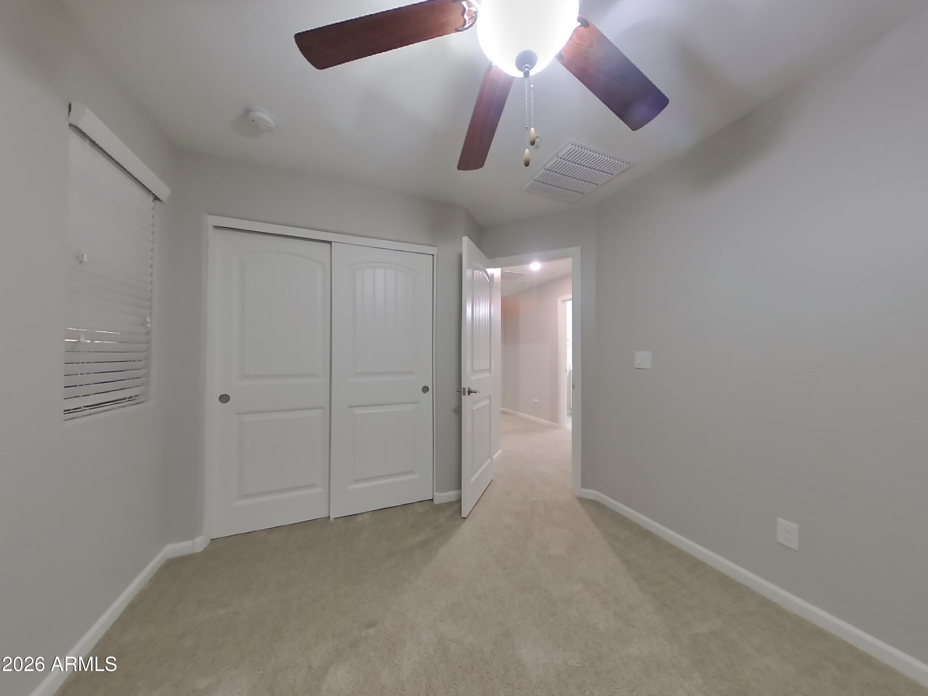 12563 West Gentle Rain Road Peoria, AZ 85383 - Photo 12 of 16 wooden floor in an empty room