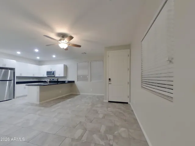 a view of kitchen and kitchen with a sink