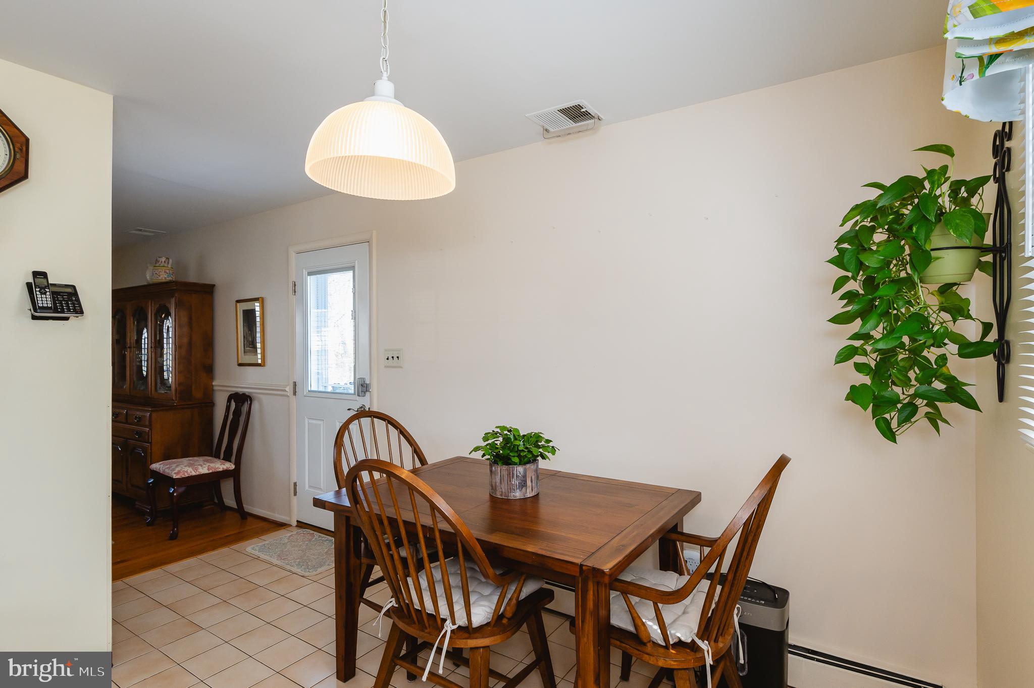 8337 Analee Avenue Rosedale, MD 21237 - Photo 14 of 48 a view of a dining room with furniture and chandelier
