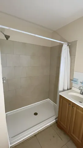 a bathroom with a tub and a shower