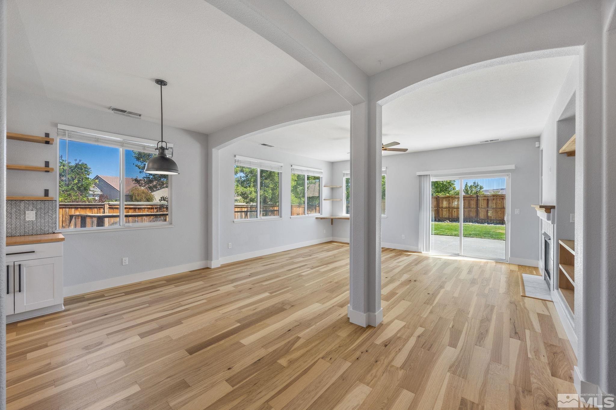 10600 Arbor Way Reno, NV 89521 - Photo 13 of 33 a view of an empty room with wooden floor and a window