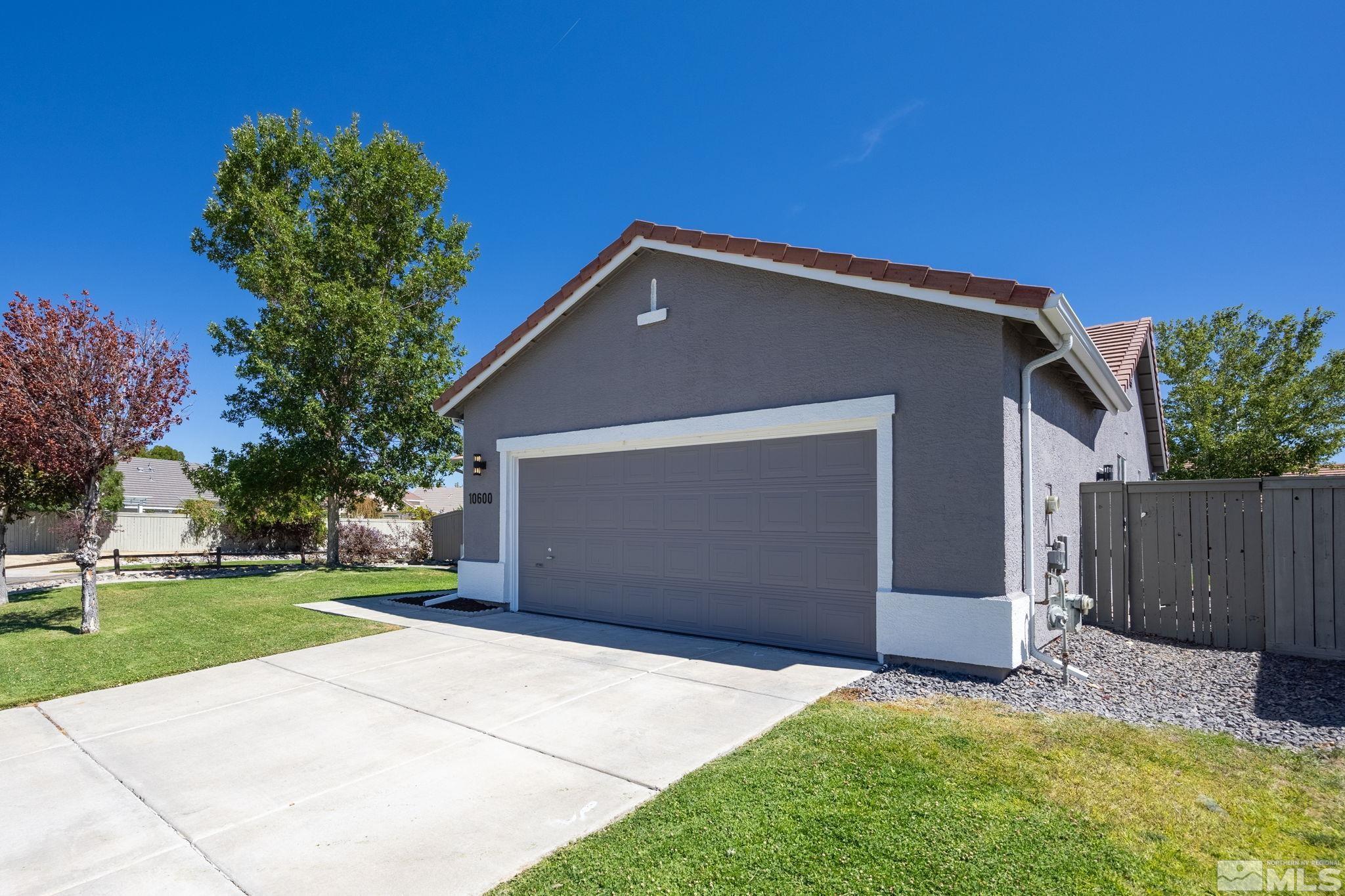 10600 Arbor Way Reno, NV 89521 - Photo 2 of 33 a front view of a house with a yard