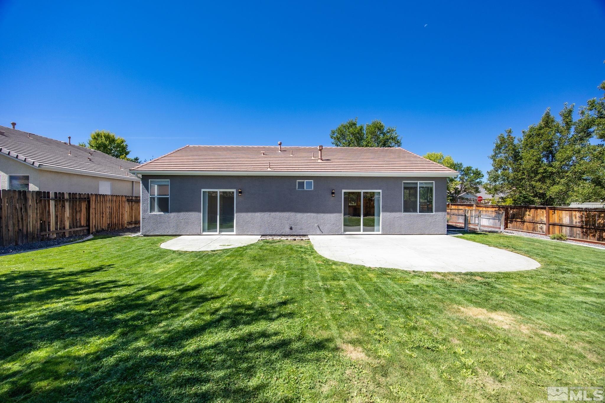 10600 Arbor Way Reno, NV 89521 - Photo 27 of 33 a front view of a house with a yard