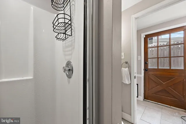 a bathroom with a shower and a window