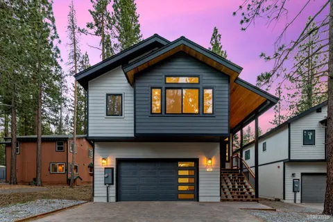 a front view of a house with garage