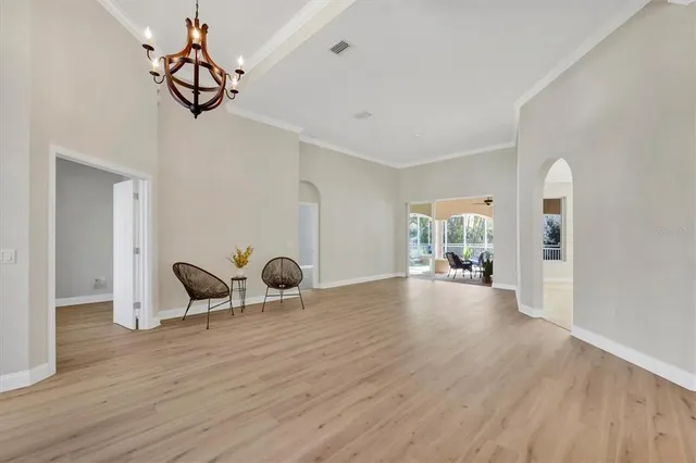 a view of a livingroom with furniture and hardwood floor