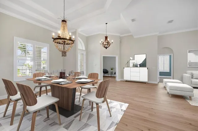 a view of a dining room with furniture window and wooden floor