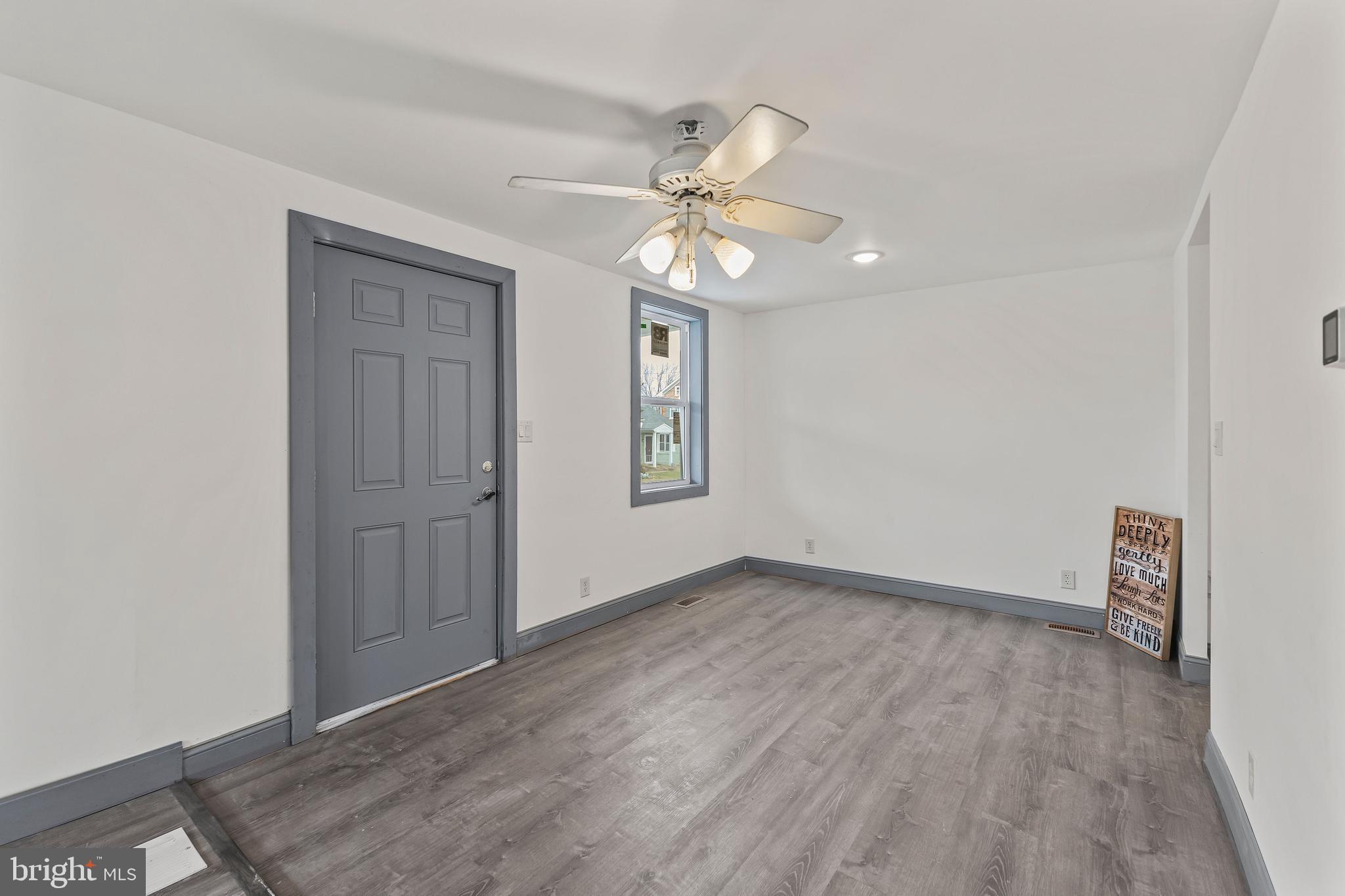780 White Hall Road Littlestown, PA 17340 - Photo 27 of 36 a view of an empty room with window and chandelier fan