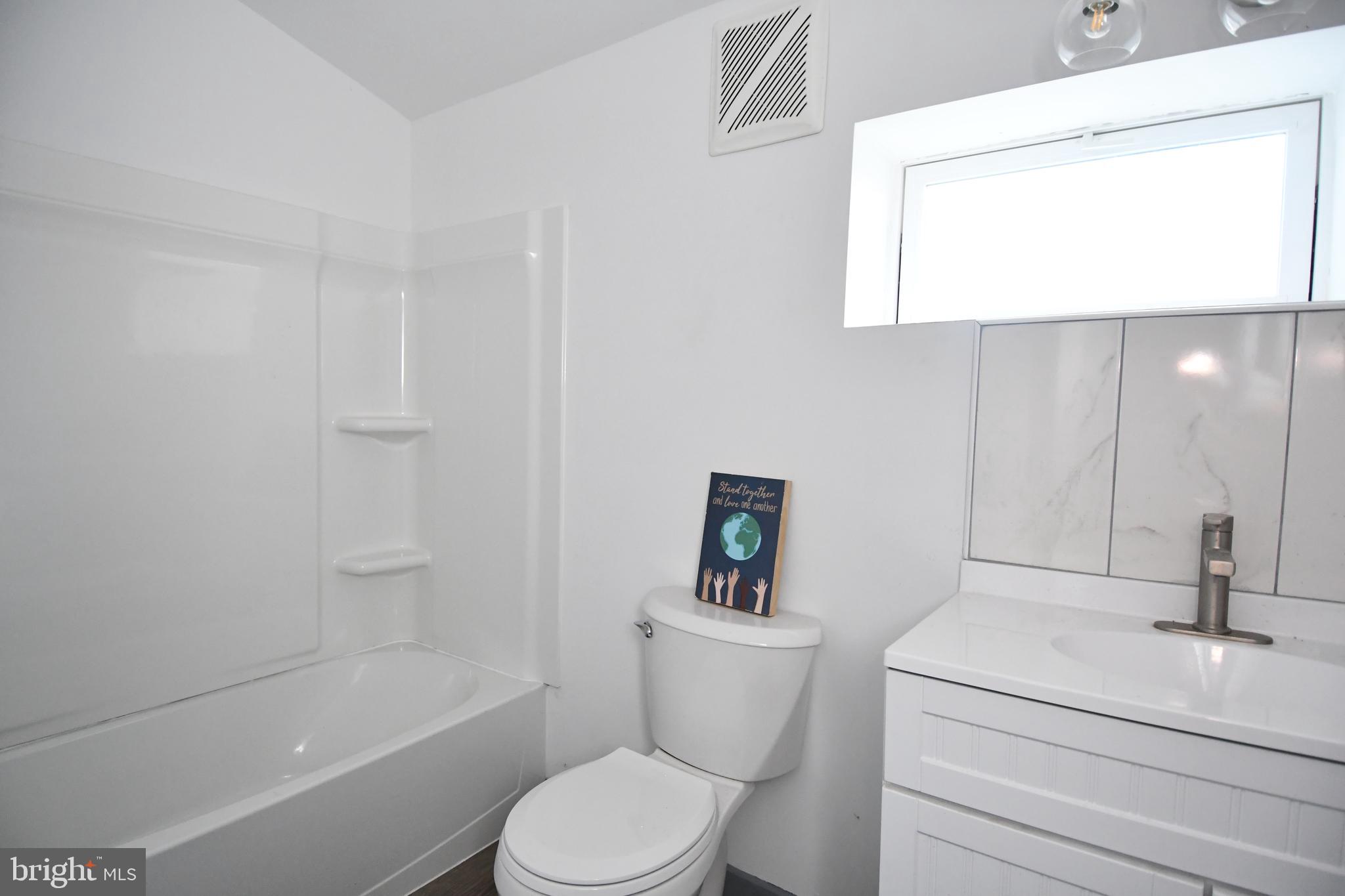 780 White Hall Road Littlestown, PA 17340 - Photo 10 of 36 a white toilet sitting next to a bathroom sink and tub