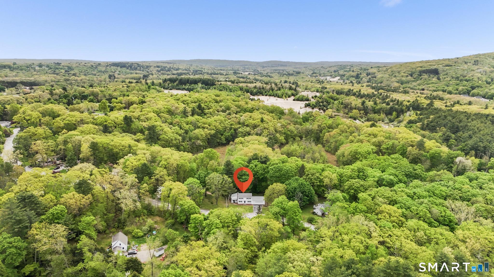 7 Sycamore Terrace Windham, CT 06280 - Photo 40 of 40 a view of a city with lush green forest